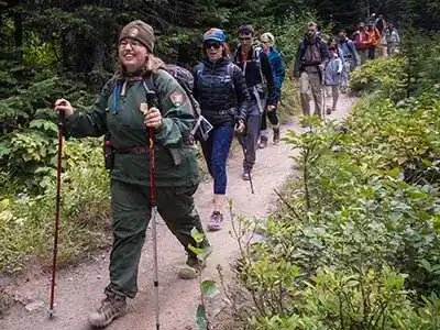 hiking-with-ranger 12 people in line hiking narrow trail