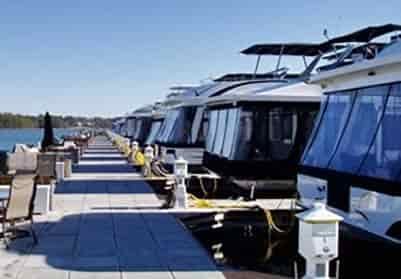 30 house boats lined up in a dock at Holiday Marina Buford Georgia