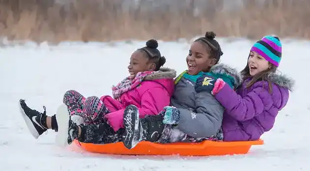 3 girls Sledding