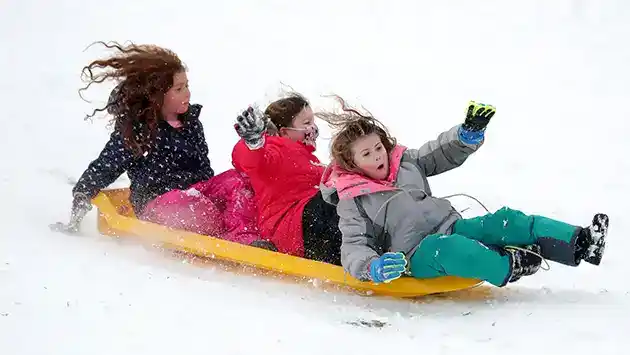 3 girls go fast while sledding