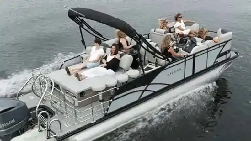 adults riding in sylvan pontoon