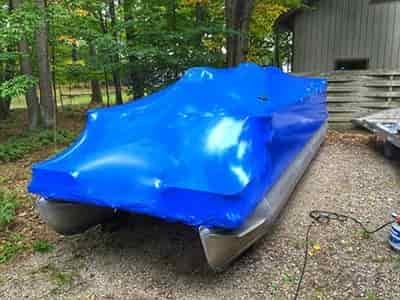 shrink wrapped pontton boat nice and tight for a winter season storage