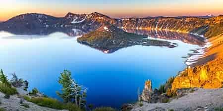 crater lake in the summer time sun setting