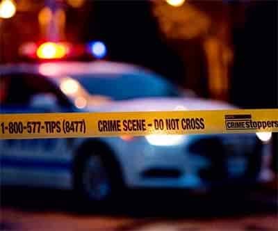 crime scene investigation police cars and crime scene tape