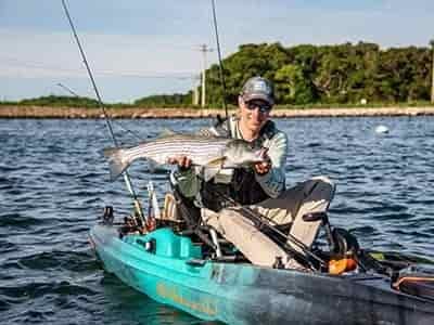 well equiped man caught large snook while fishing in kayak